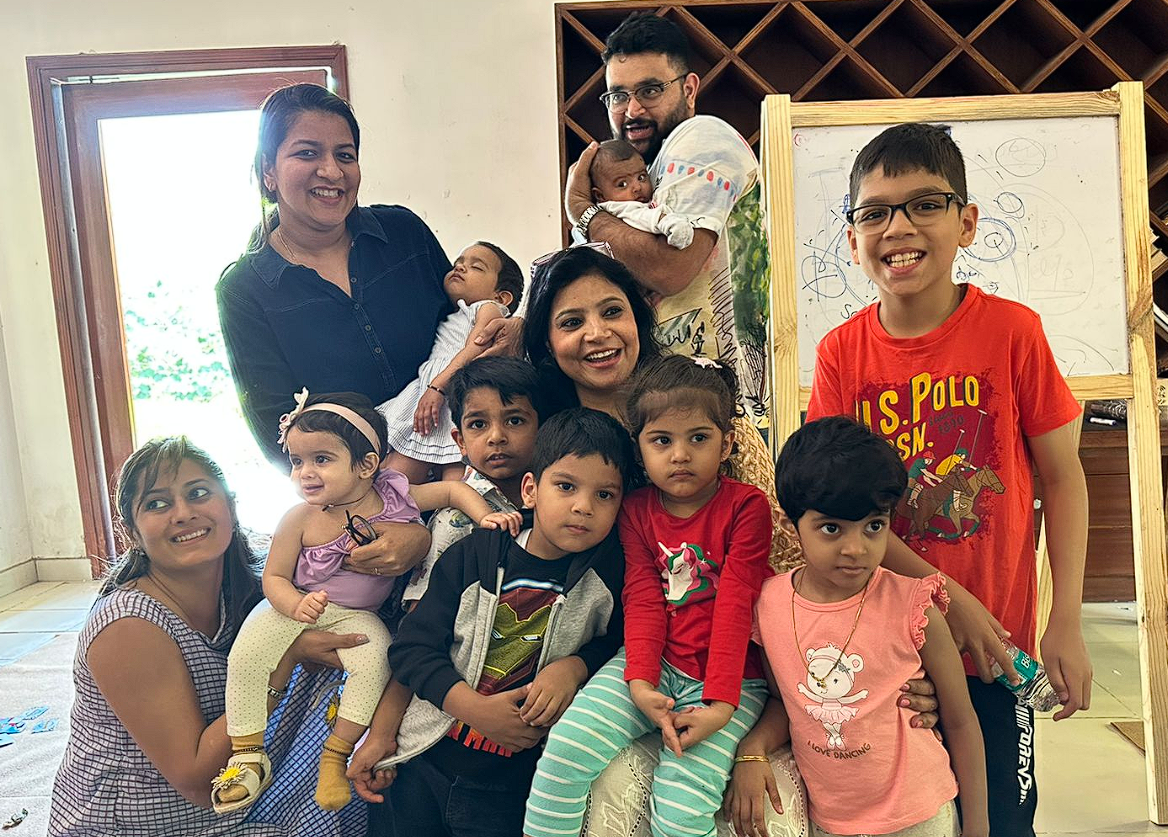 Dr. Monika with retreat families and their babies