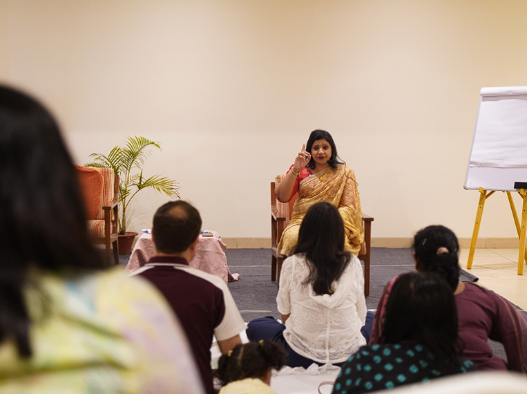 Dr. Monika guiding participants during a Day One grounding session