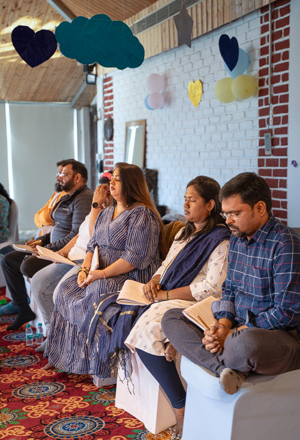 Participants in meditation with eyes closed