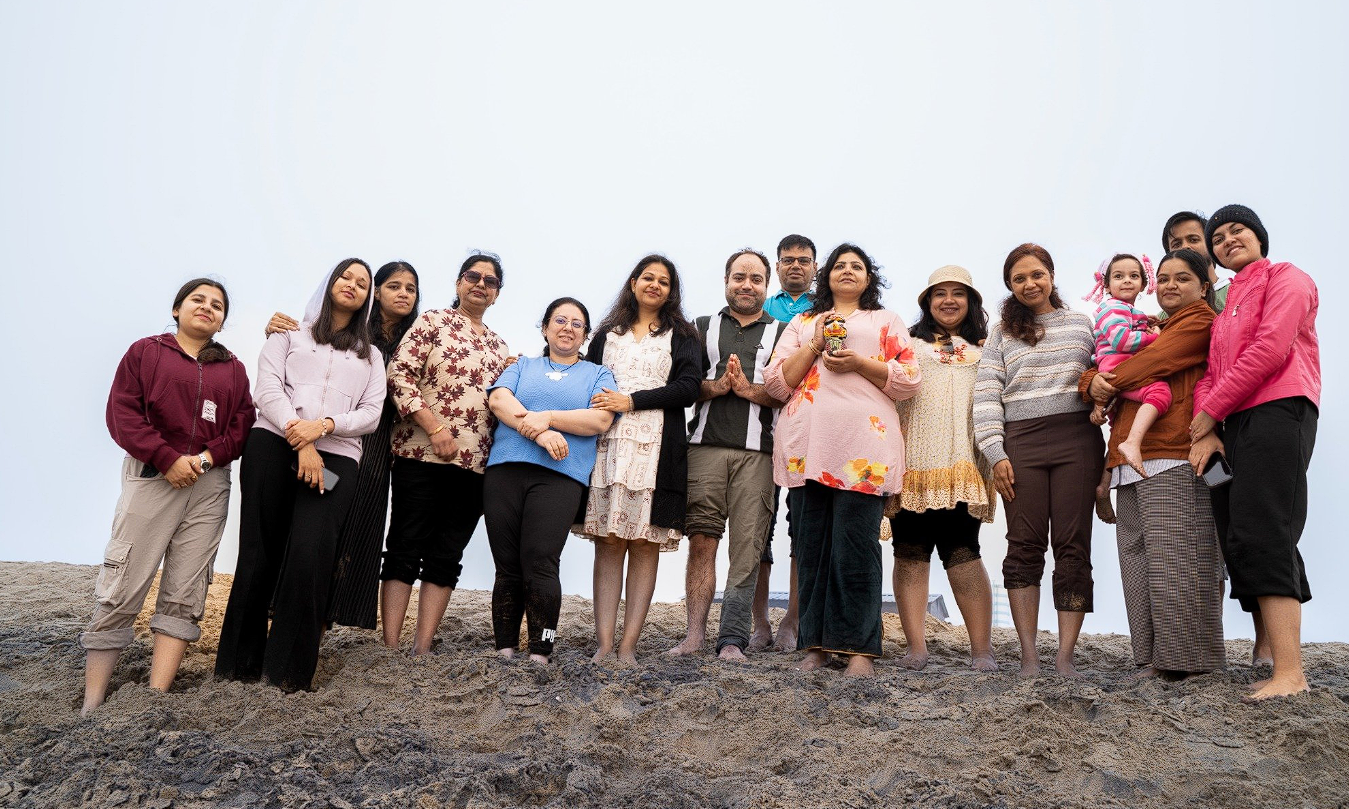 Retreat family group portrait on the beach